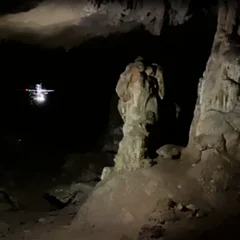Autonomous Cave Surveying with an Aerial Robot